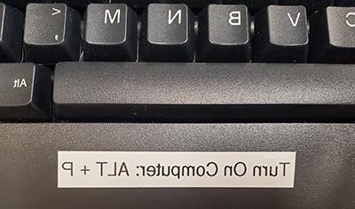Keyboard with a label that reads Turn On Computer: ALT + P
